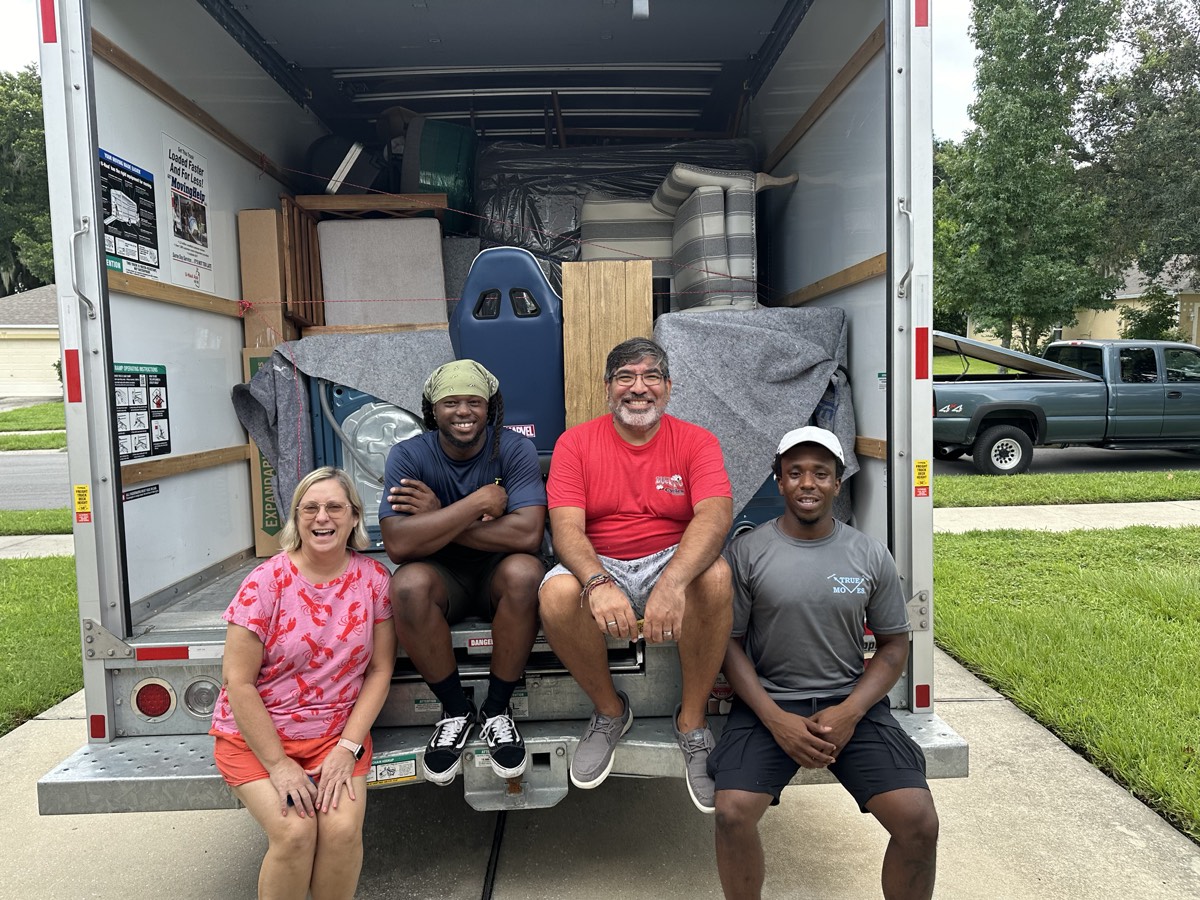 True Moves crew and a satisfied customer at the end of a move